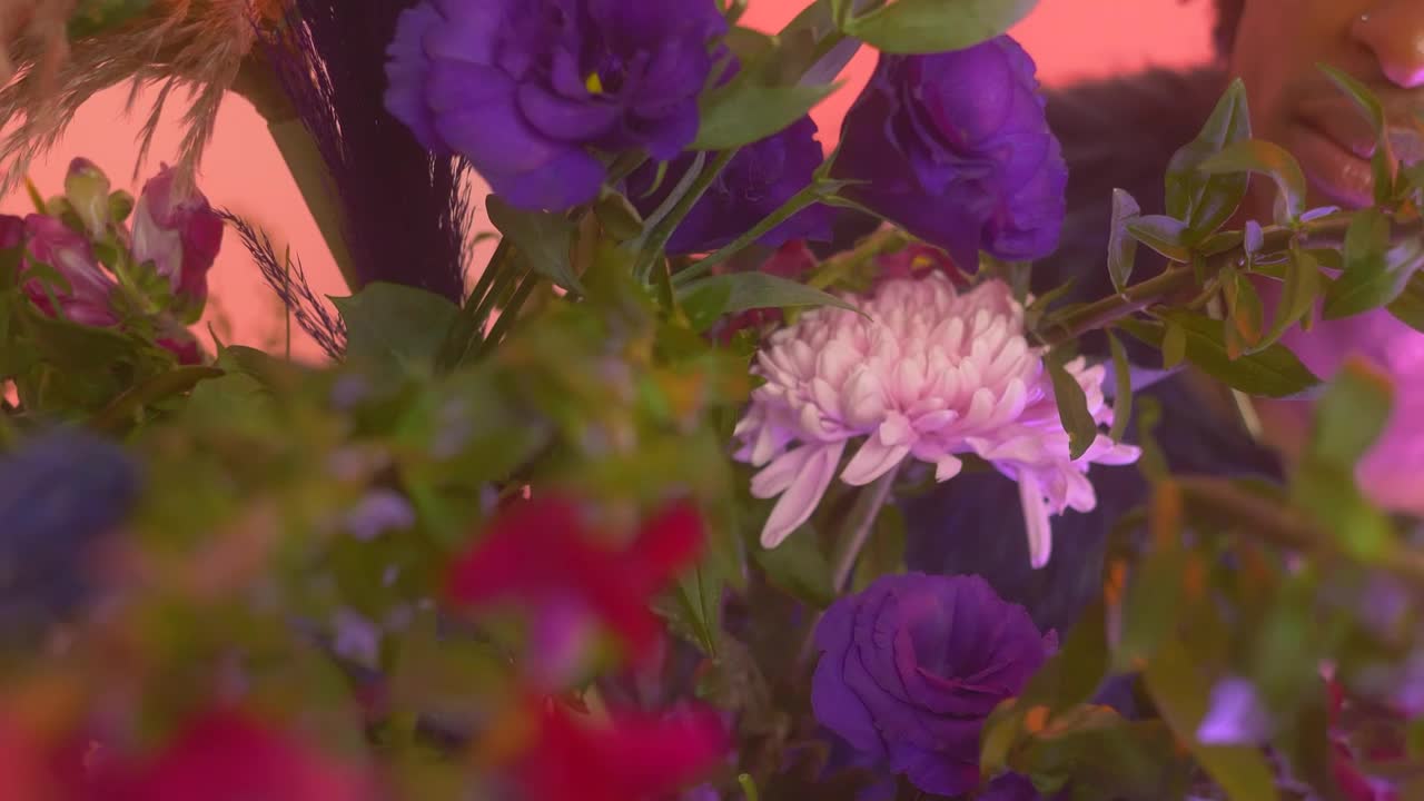 Stock Video Lgbtq Man Taking A Flower In A Pink Setting Animated Wallpaper