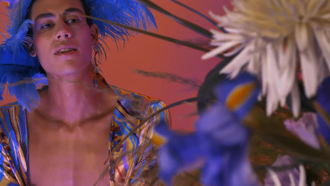 Stock Video Lgbtq Guy With A Striking And Feminine Wardrobe Animated Wallpaper