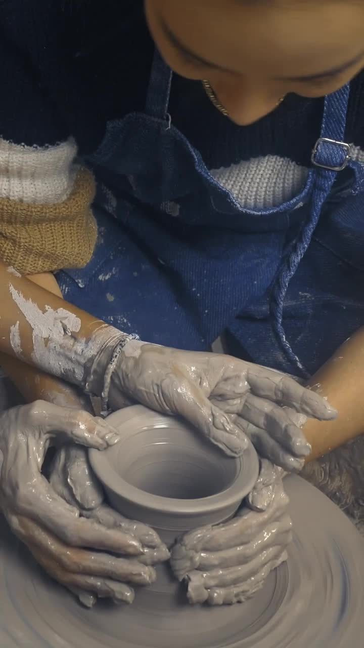 Stock Video Lgbtq Female Couple Modeling A Clay Vase Together Animated Wallpaper