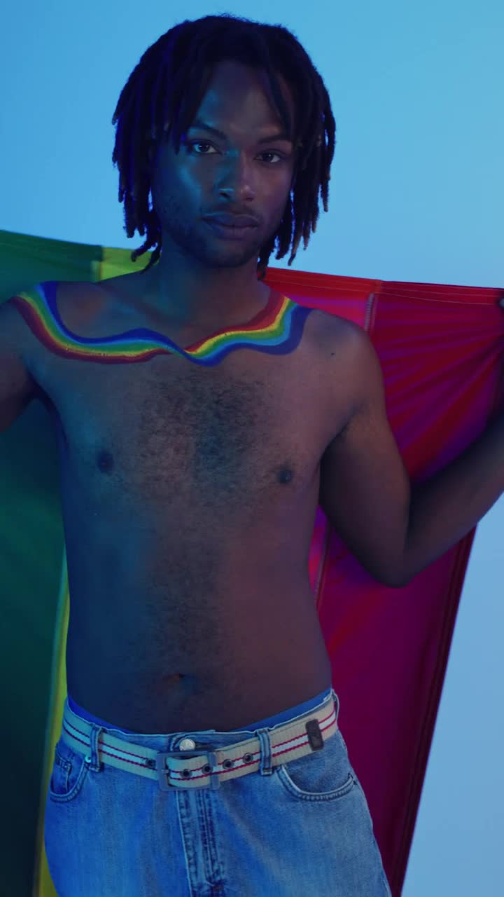 Stock Video Lgbt Man Playing With Lgbt Pride Flag Animated Wallpaper
