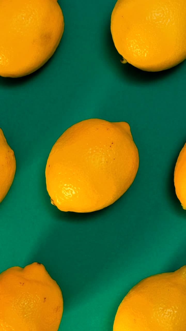 Stock Video Lemons Placed On A Green Surface Animated Wallpaper