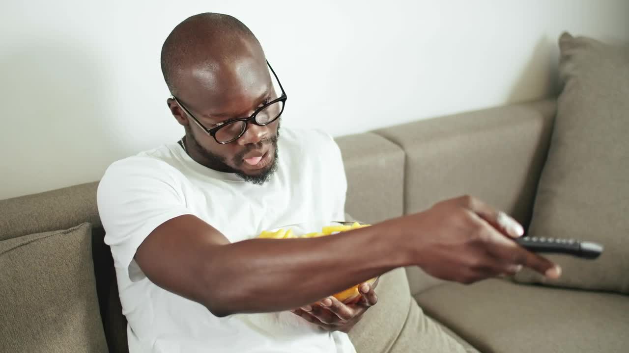 Stock Video Lazy Man Watching Television On His Sofa Animated Wallpaper