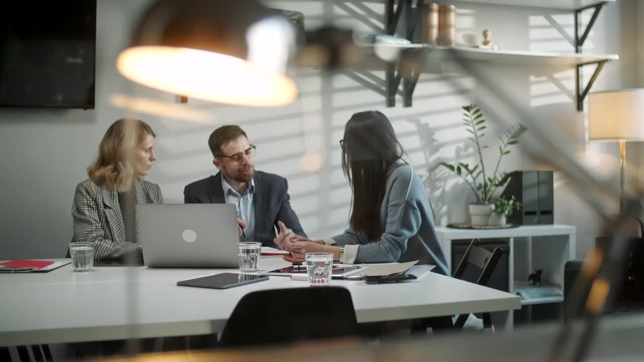Stock Video Lawyers Talk With Client In Late Evening Office Animated Wallpaper