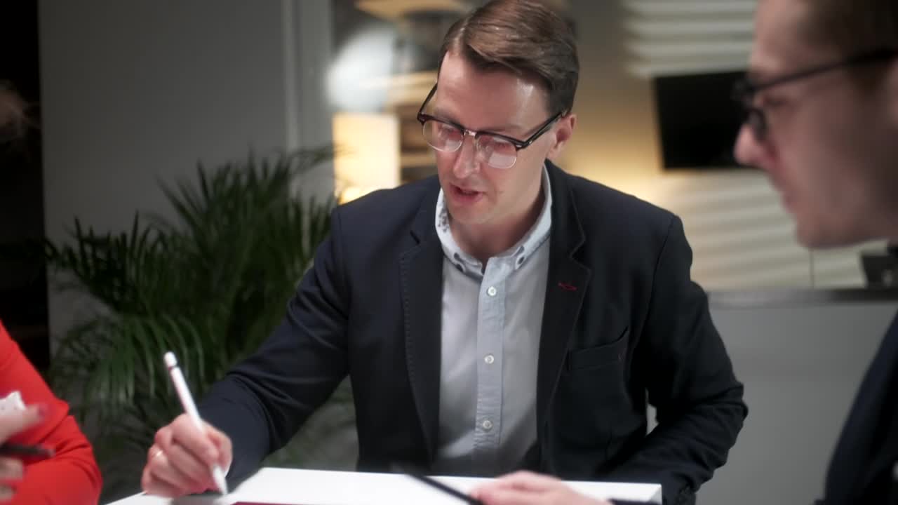 Stock Video Lawyers Discuss Strategy In Late Night Meeting Animated Wallpaper