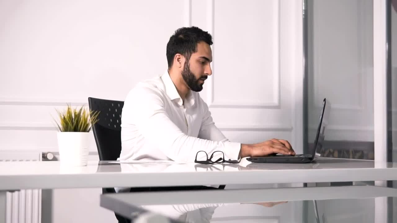 Stock Video Lawyer Working On Laptop Turns And Smiles Animated Wallpaper