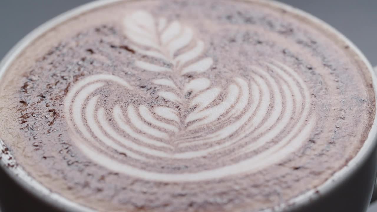 Stock Video Latte Leaf Drawing In A Cup Macro Close Up Animated Wallpaper