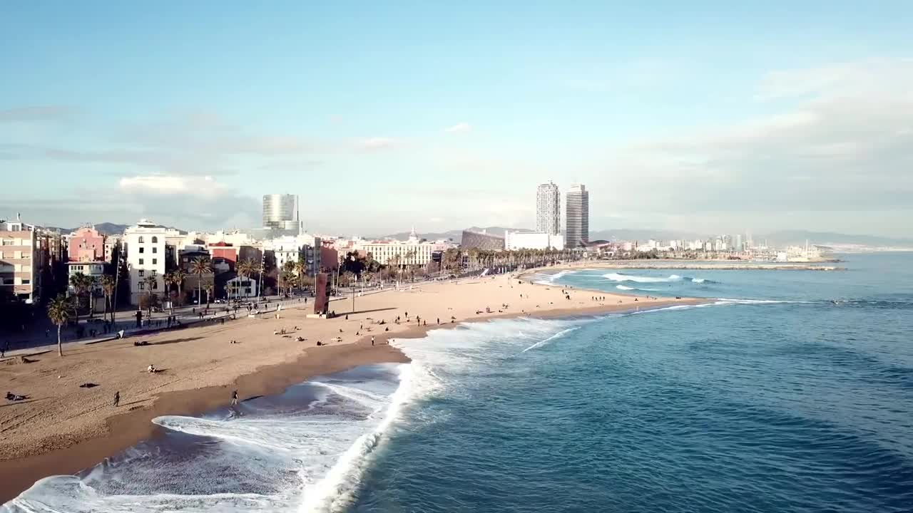 Stock Video Large Waves Breaking Along A City Beach Animated Wallpaper