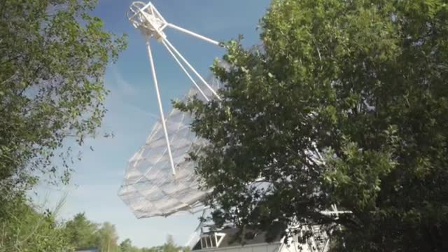 Stock Video Large Satellite Antenna In The Forest Smal Animated Wallpaper