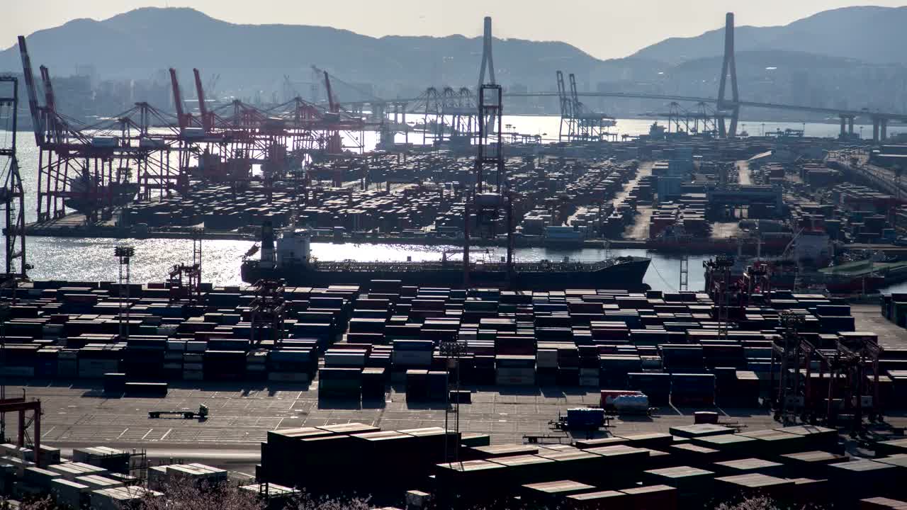 Stock Video Large Container Area On A Shoreline On A Sunny Day Animated Wallpaper