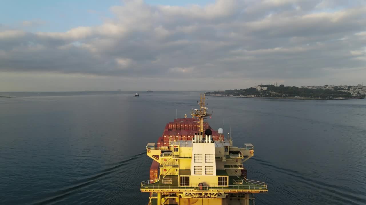 Stock Video Large Cargo Ship Sailing Away From A Port Animated Wallpaper