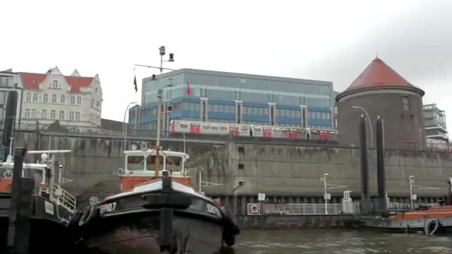 Stock Video Large Boats Docked In A City River Smal Animated Wallpaper