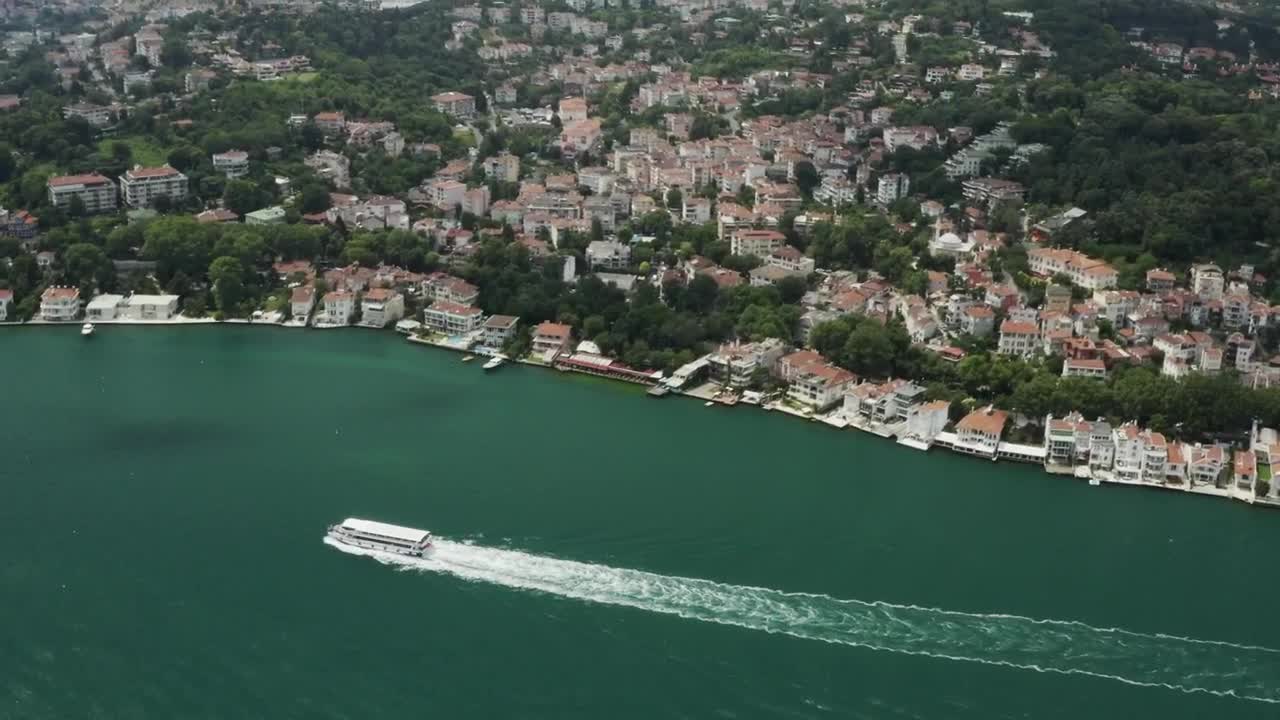 Stock Video Large Boat Heading By The Waterfront Animated Wallpaper