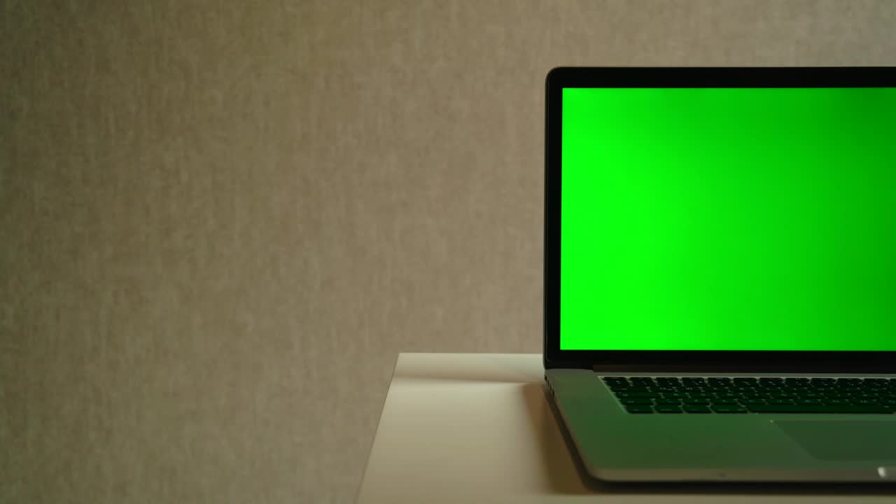 Stock Video Laptop Devise With A Green Screen Animated Wallpaper