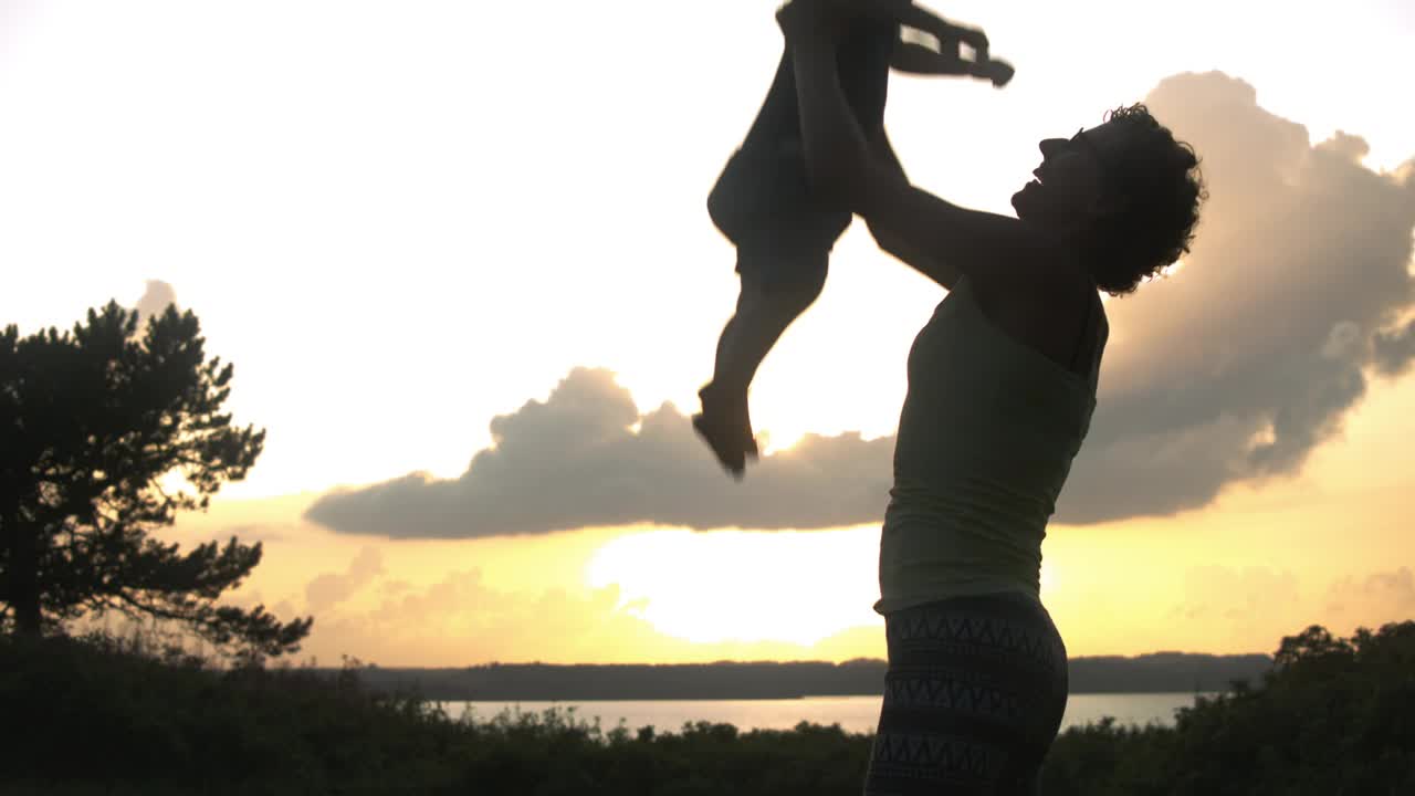 Stock Video Mother Throwing Her Son Upward Animated Wallpaper