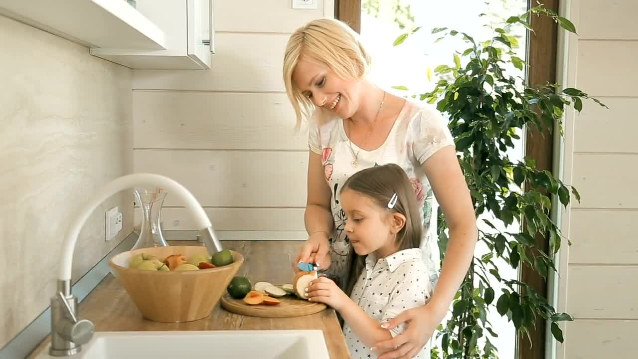 Stock Video Mother Teaches Her Daughter To Make A Sala Animated Wallpaper