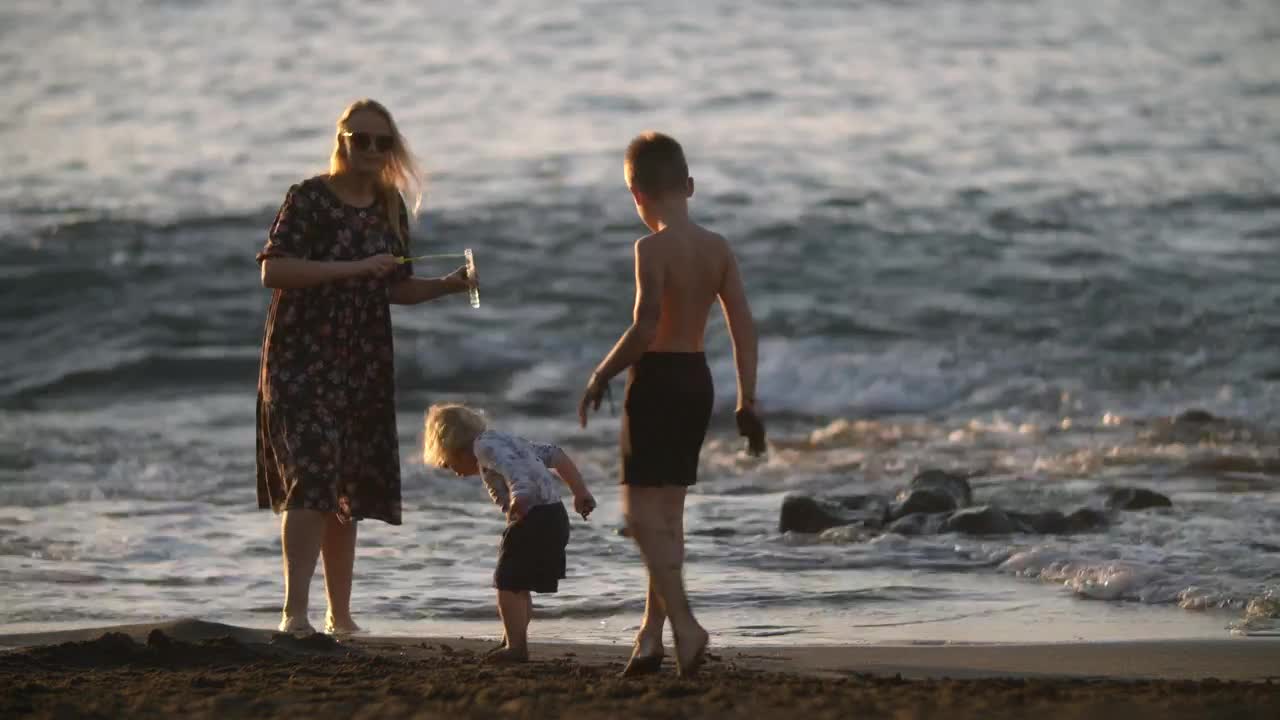 Stock Video Mother Playing With Her Two Childre Animated Wallpaper