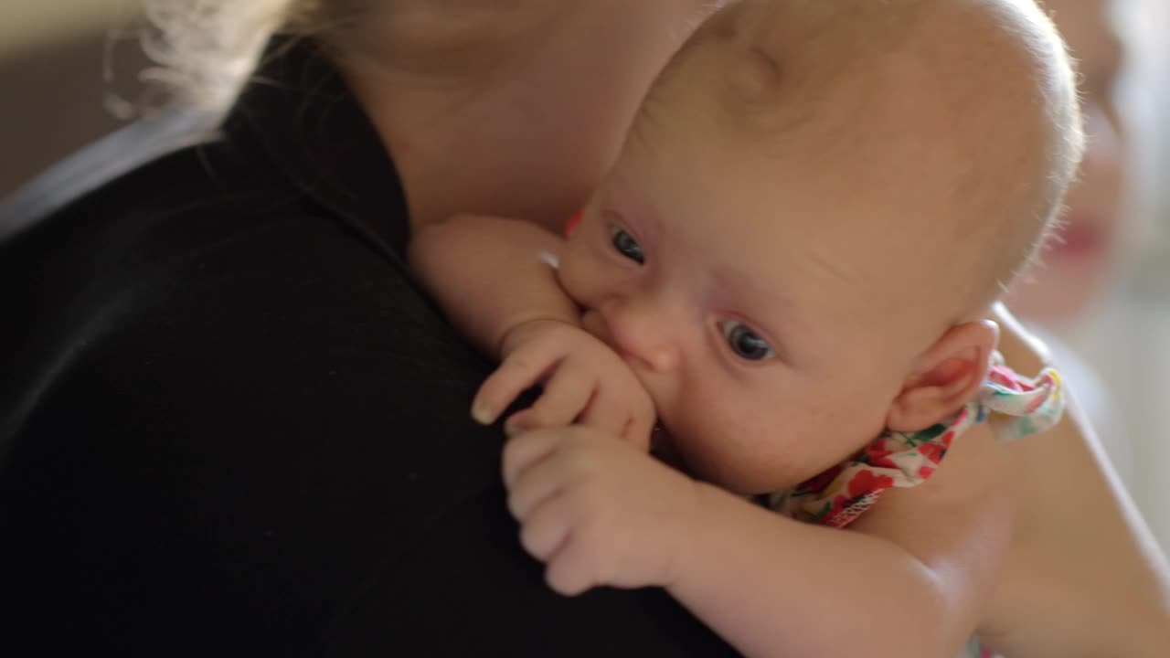 Stock Video Mother Holding Her Quiet Bab Animated Wallpaper