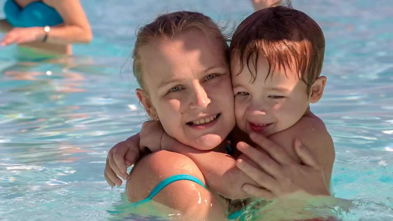 Stock Video Mother Holding Her Child In The Poo Animated Wallpaper