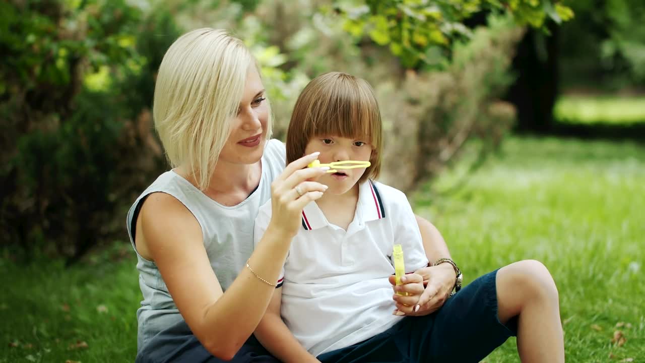 Stock Video Mother Enjoying Time With Her Son In The Par Animated Wallpaper