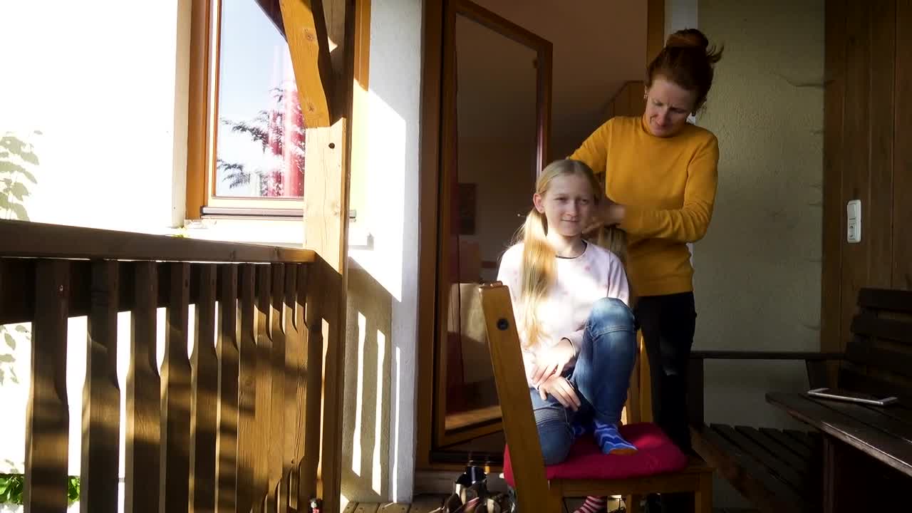 Stock Video Mother Brushing Her Daughters Hai Animated Wallpaper