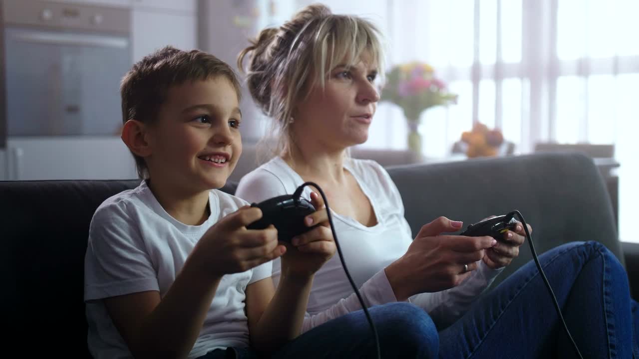 Stock Video Mother And Son Playing An Old Consol Animated Wallpaper