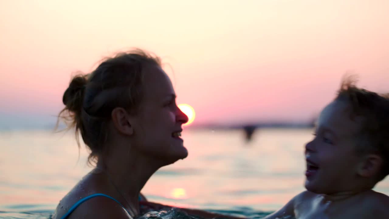 Stock Video Mother And Son Jumping In The Ocea Animated Wallpaper