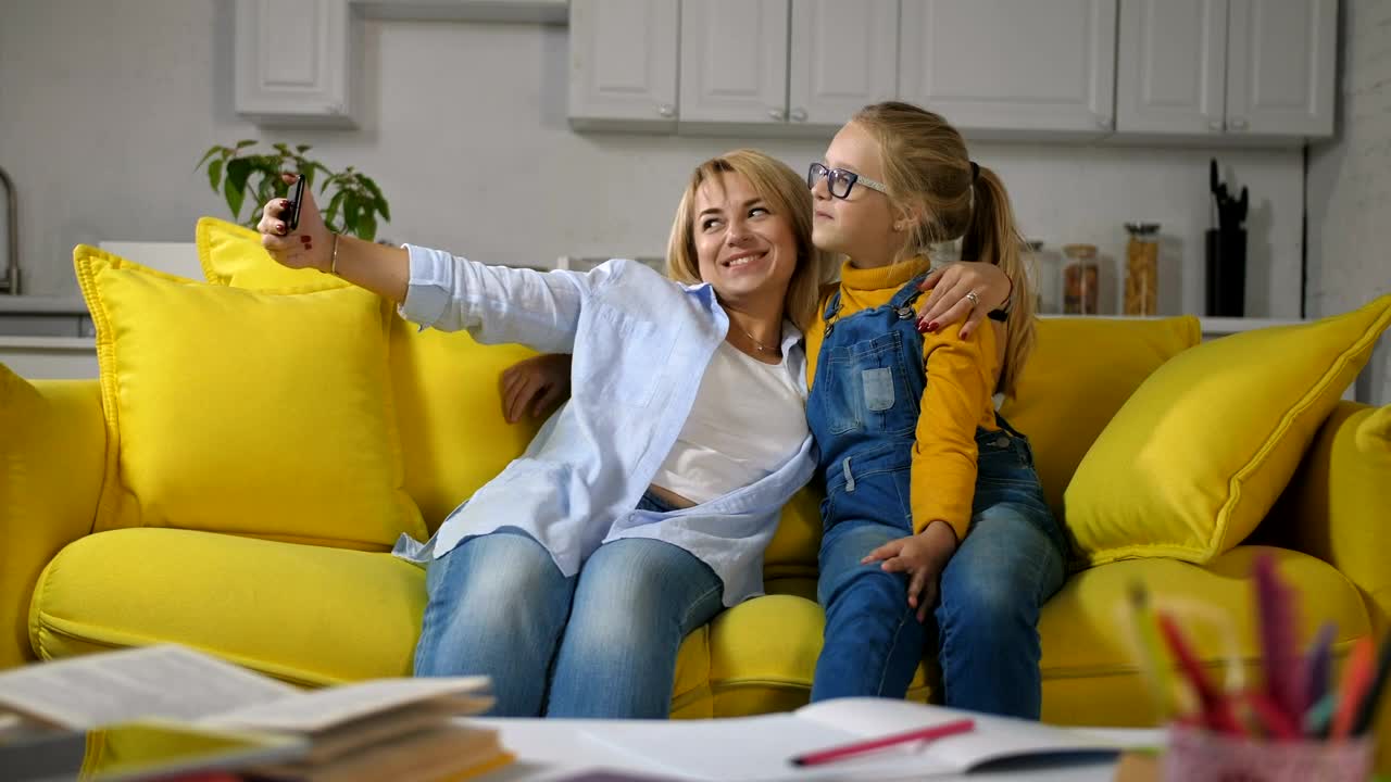 Stock Video Mother And Her Little Daughter Taking A Selfi Animated Wallpaper