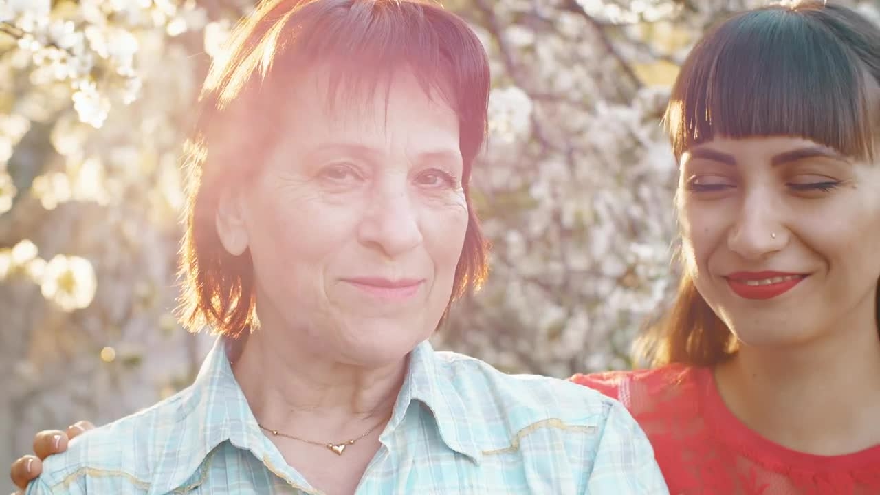 Stock Video Mother And Daughter Smiling Happily At Camer Animated Wallpaper