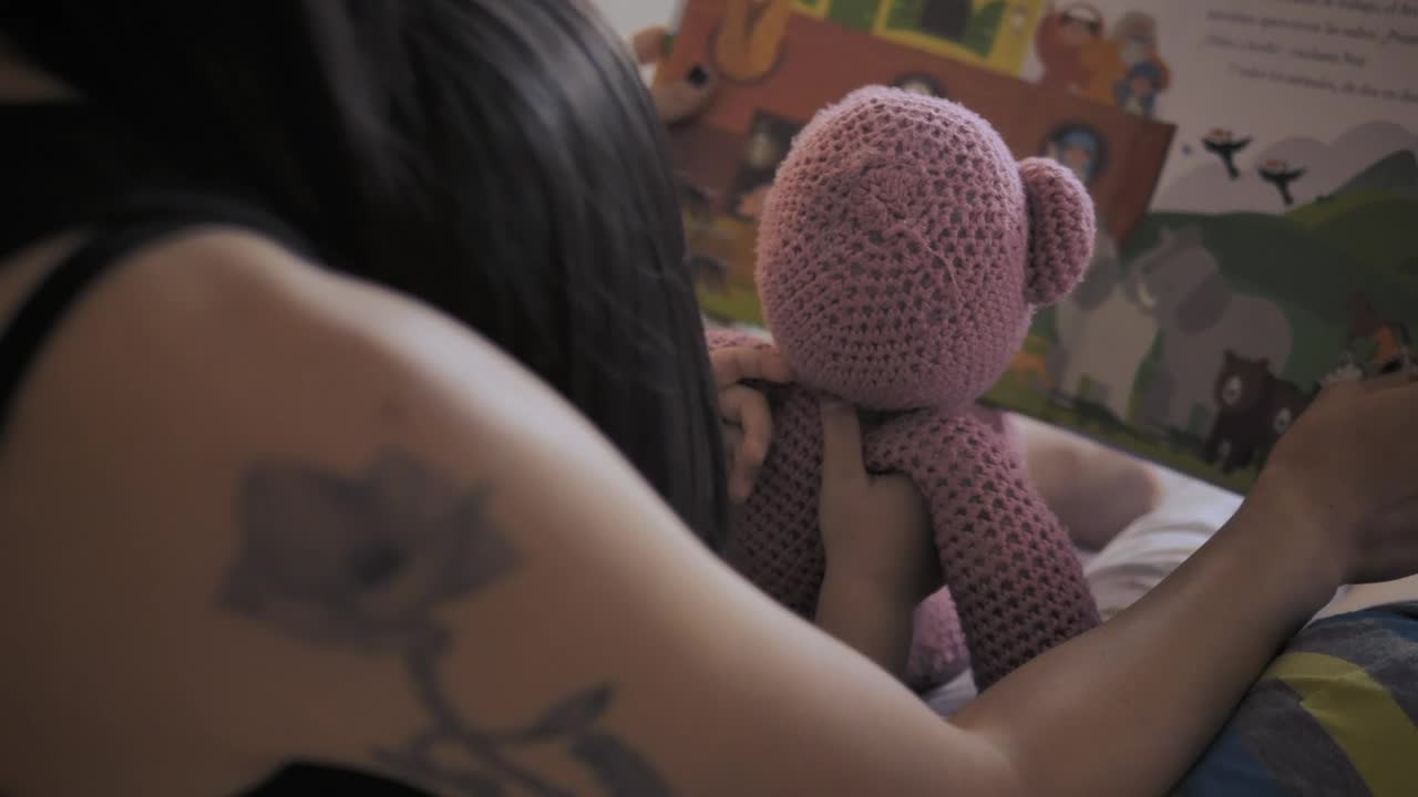 Stock Video Mother And Daughter Reading A Childrens Book Back Vie Animated Wallpaper