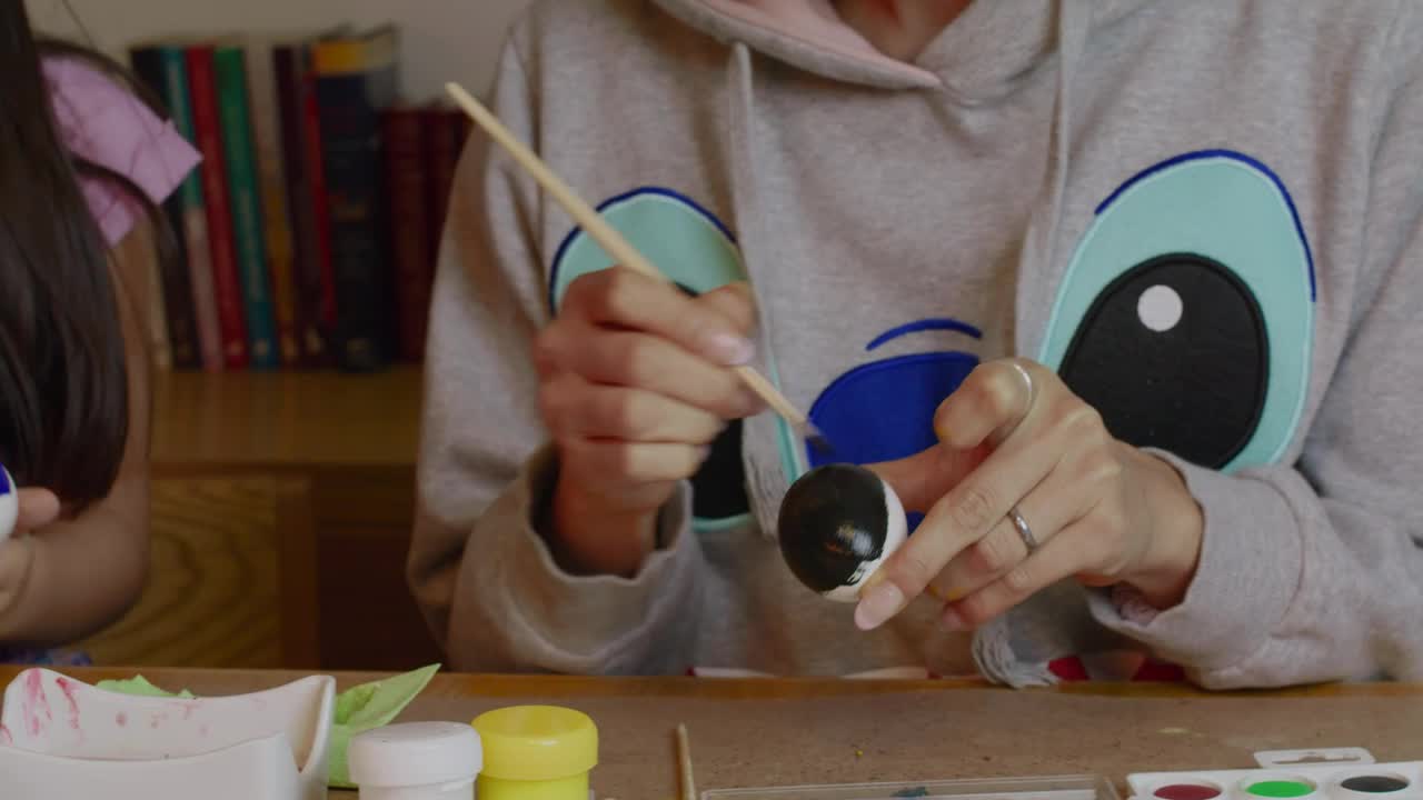 Stock Video Mother And Daughter Preparing Decorations For Easte Animated Wallpaper