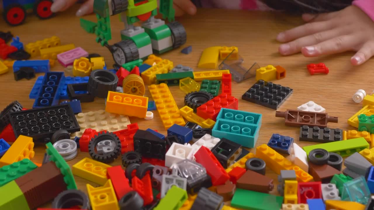 Stock Video Mother And Daughter Playing With Lego Brick Animated Wallpaper