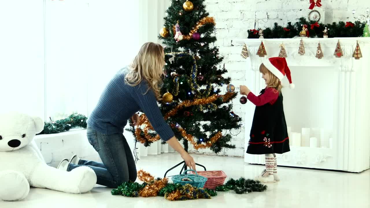 Stock Video Mother And Daughter Decorating The Christmas Tre Animated Wallpaper