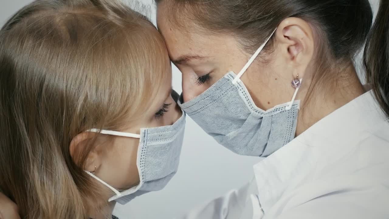 Stock Video Mother And Daughter Crying With Facemask Animated Wallpaper