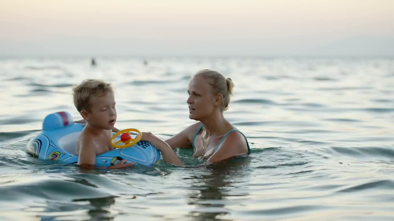 Stock Video Mother And Child Playing In The Ocea Animated Wallpaper