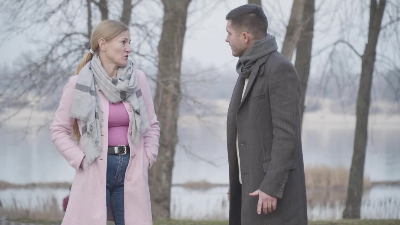 Stock Video Mother And Adult Son Quarrel On Cold Day In Par Animated Wallpaper