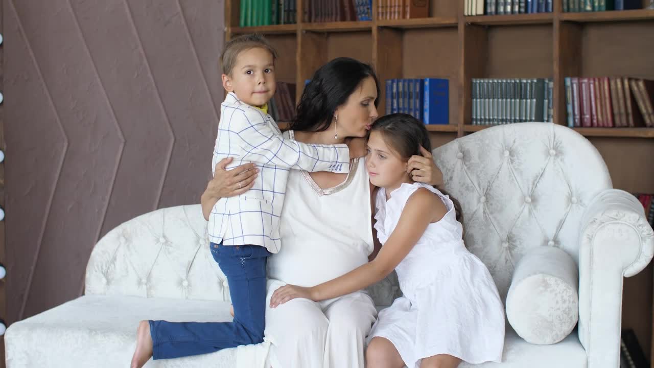 Stock Video Mom Hugs And Kisses Her Daughters Portrai Animated Wallpaper