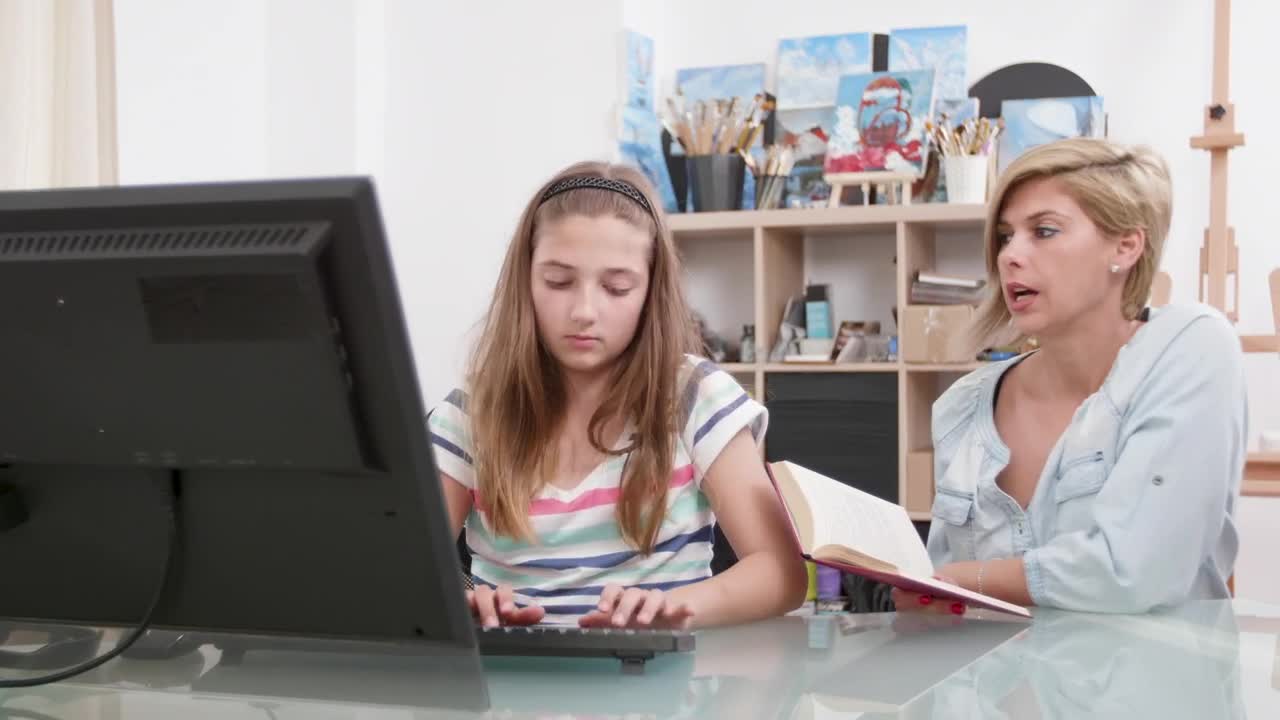 Stock Video Mom Helping Girl Learn Computer Skill Animated Wallpaper