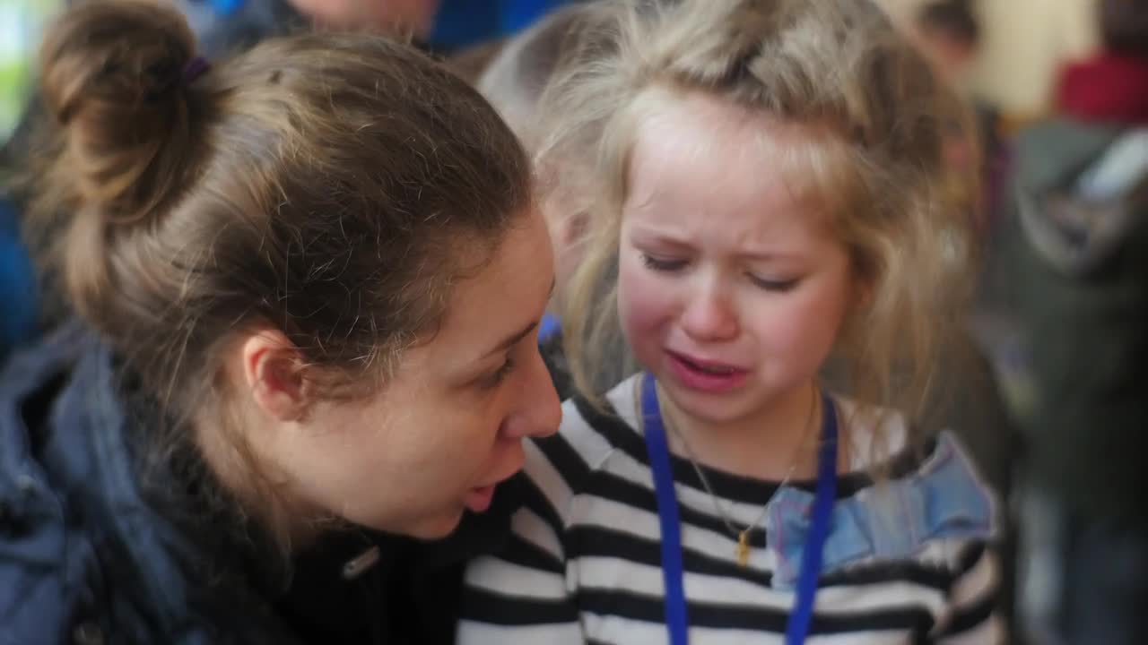 Stock Video Mom Comforting His Crying Gir Animated Wallpaper