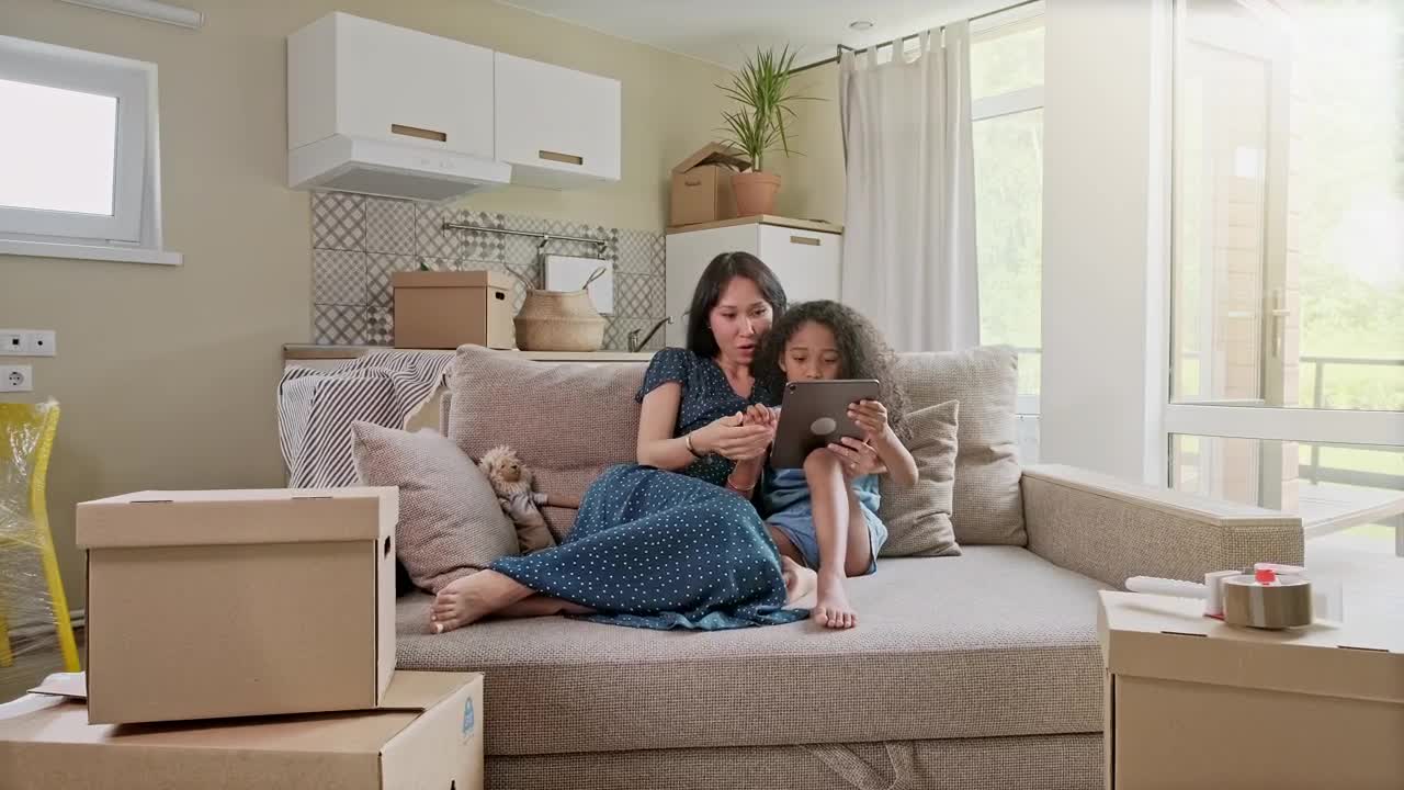 Stock Video Mom And Her Daughter Having Fun With A Table Animated Wallpaper