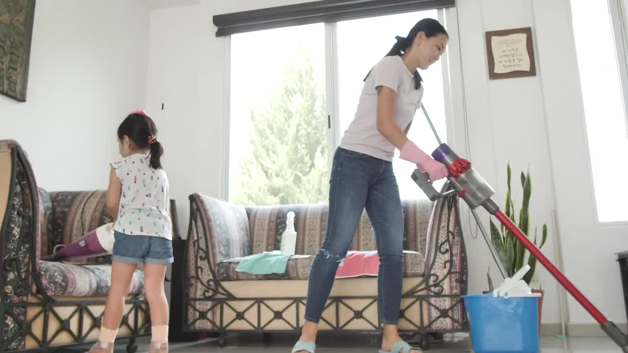 Stock Video Mom And Daughter With Vacuum Cleaners Cleaning A Roo Animated Wallpaper