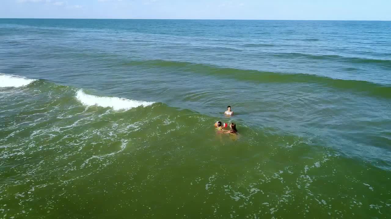 Stock Video Mom And Daughters Swimming In The Se Animated Wallpaper
