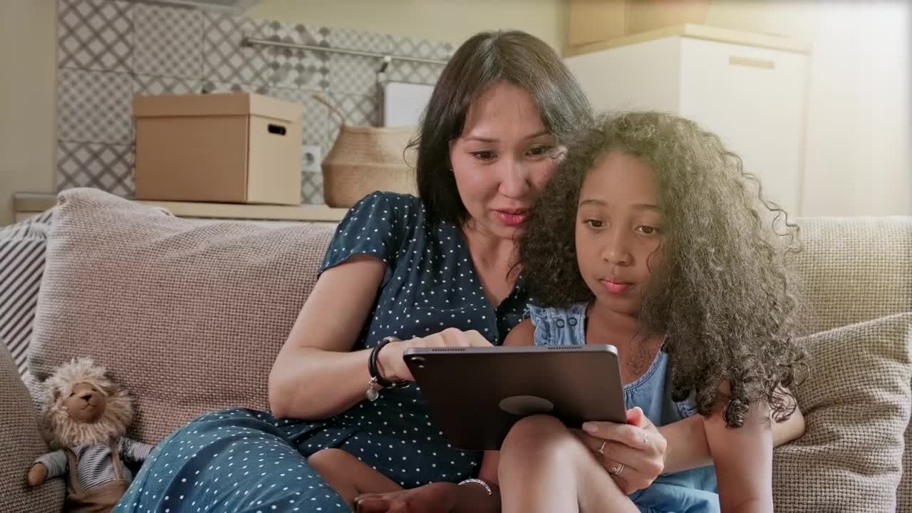 Stock Video Mom And Daughter Spending Time Together With A Table Animated Wallpaper