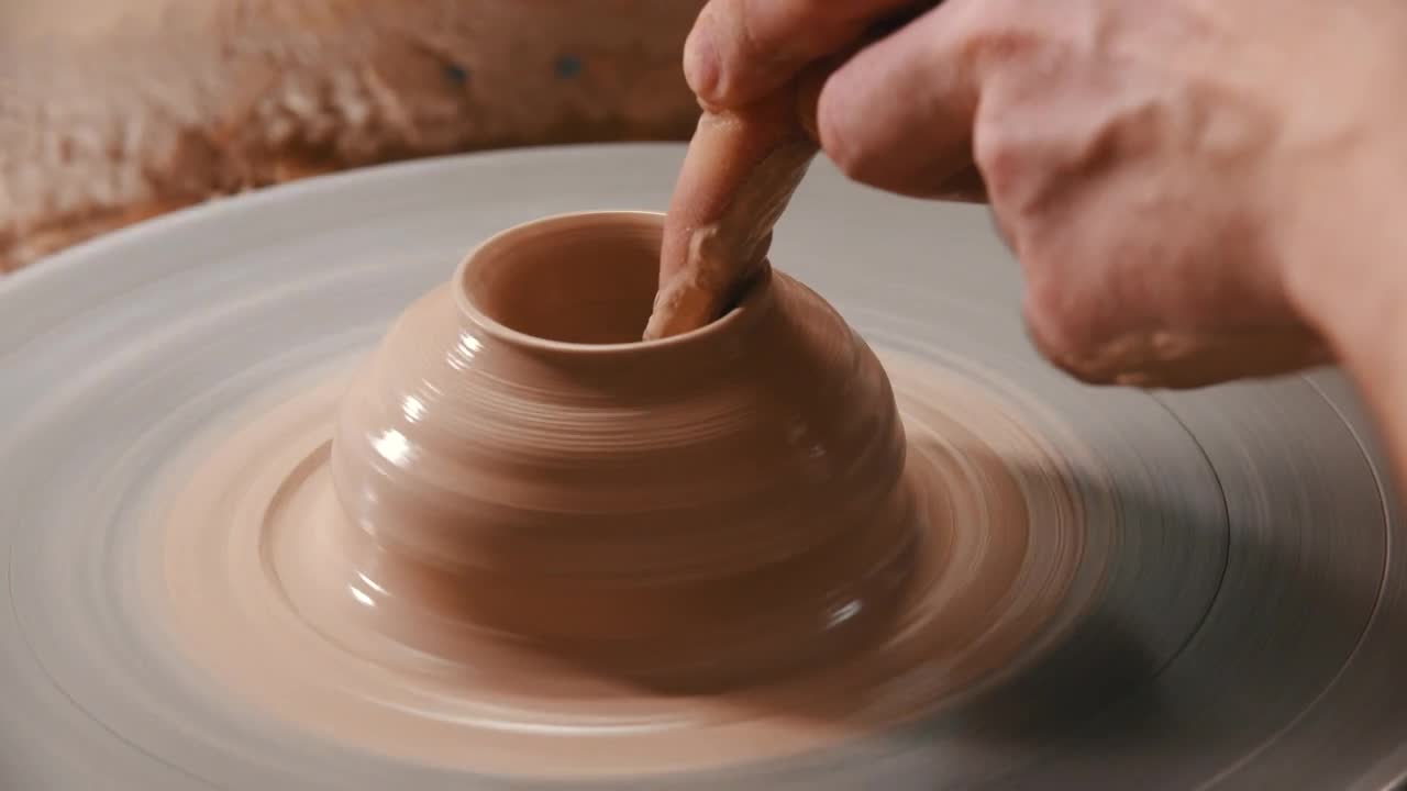 Stock Video Molding With Clay On The Spinning Whee Animated Wallpaper