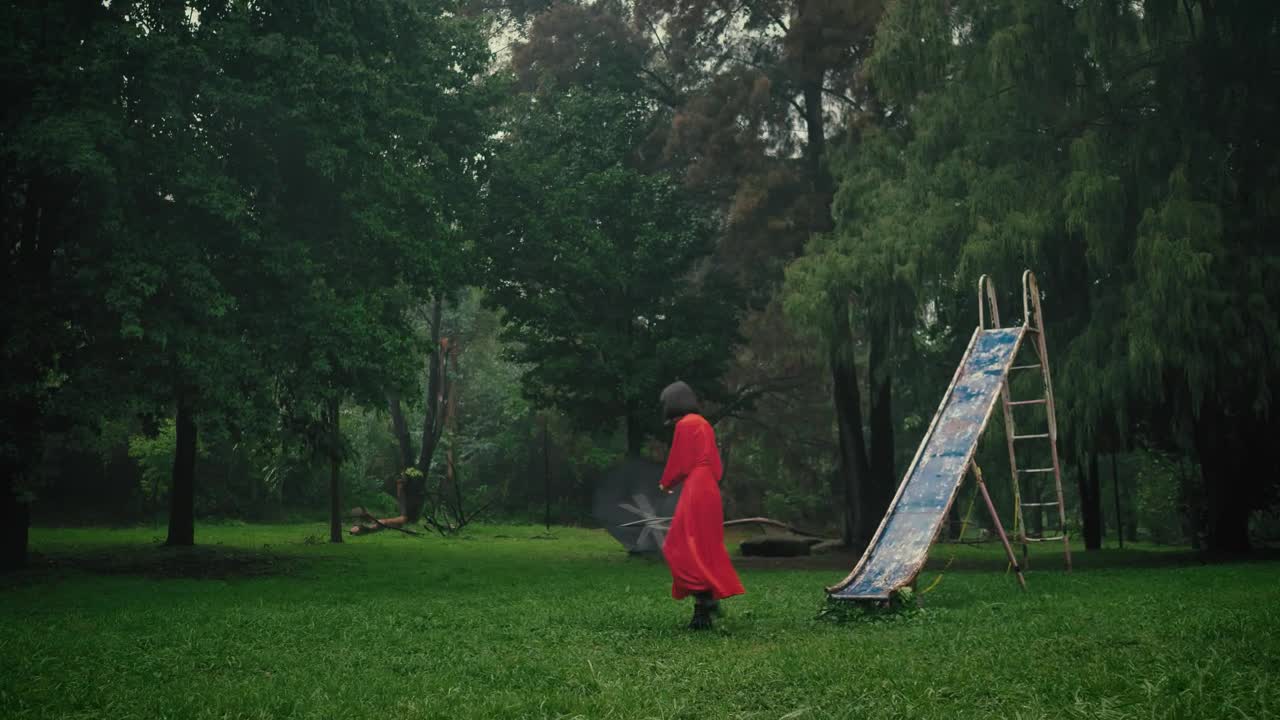 Stock Video Model With An Umbrella Nearby In A Forest Full O Animated Wallpaper