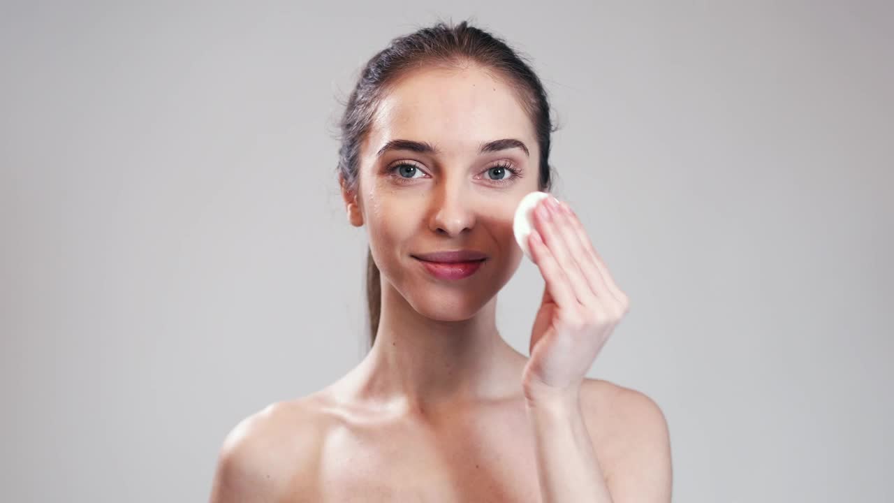 Stock Video Model Demonstrates Acne Skin Care Routin Animated Wallpaper