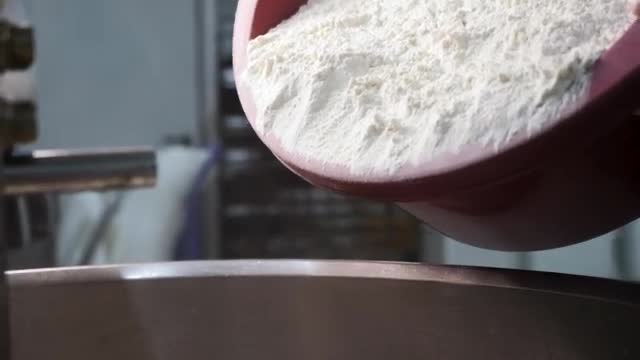 Stock Video Mixing Flour In A Large Bowl Sma Animated Wallpaper