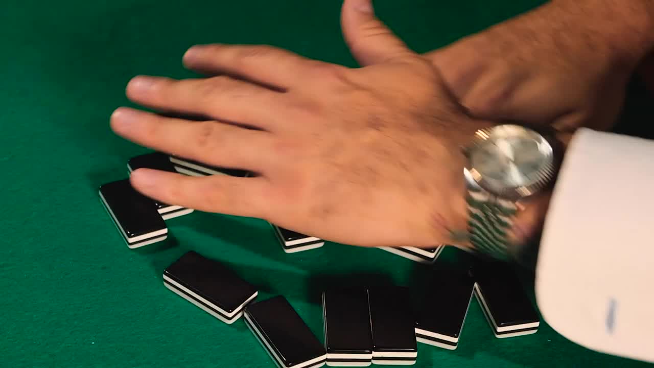 Stock Video Mixing Dominoes On A Gaming Tabl Animated Wallpaper