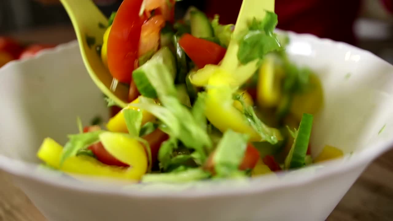 Stock Video Mixing A Fresh Salad With Oi Animated Wallpaper