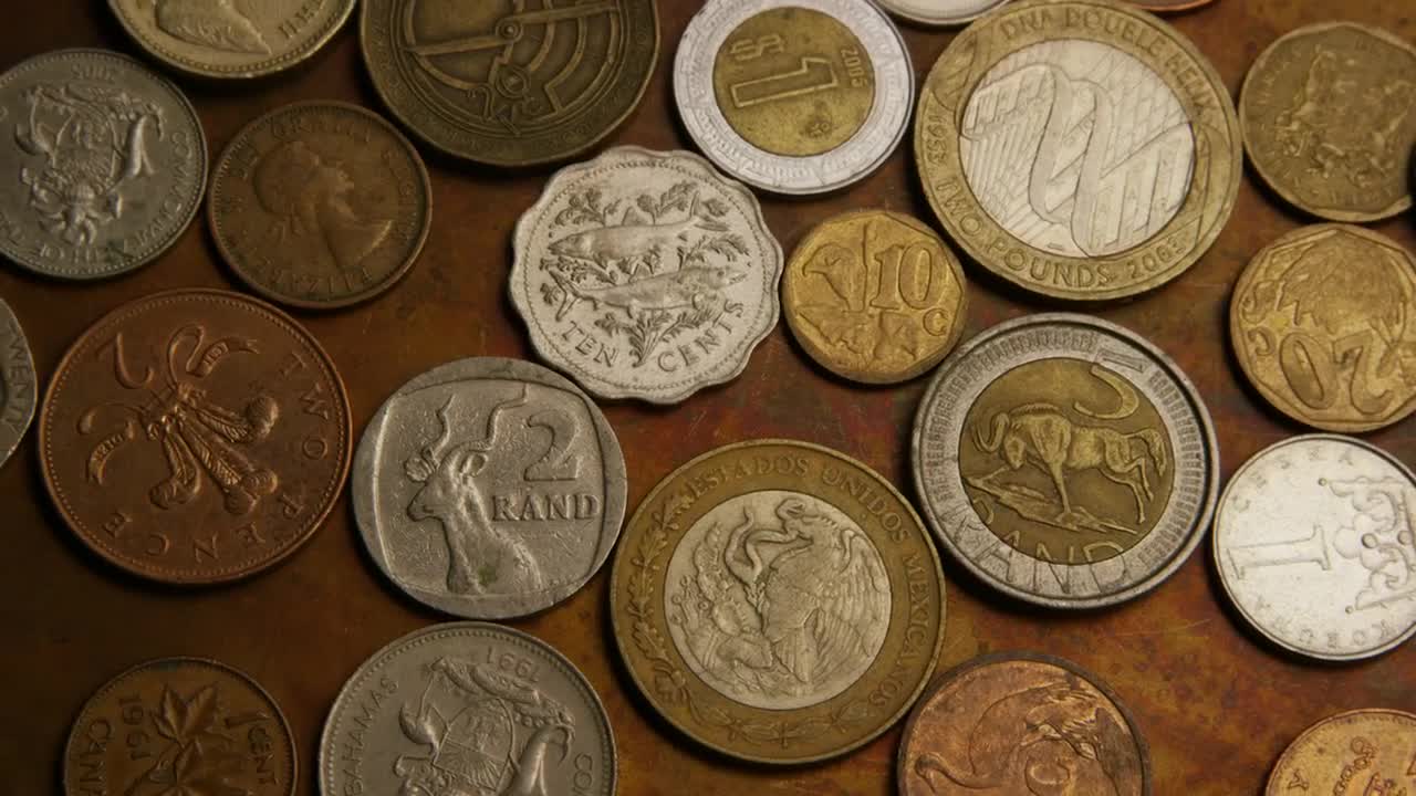 Stock Video Mix Of International Coins On The Tabl Animated Wallpaper
