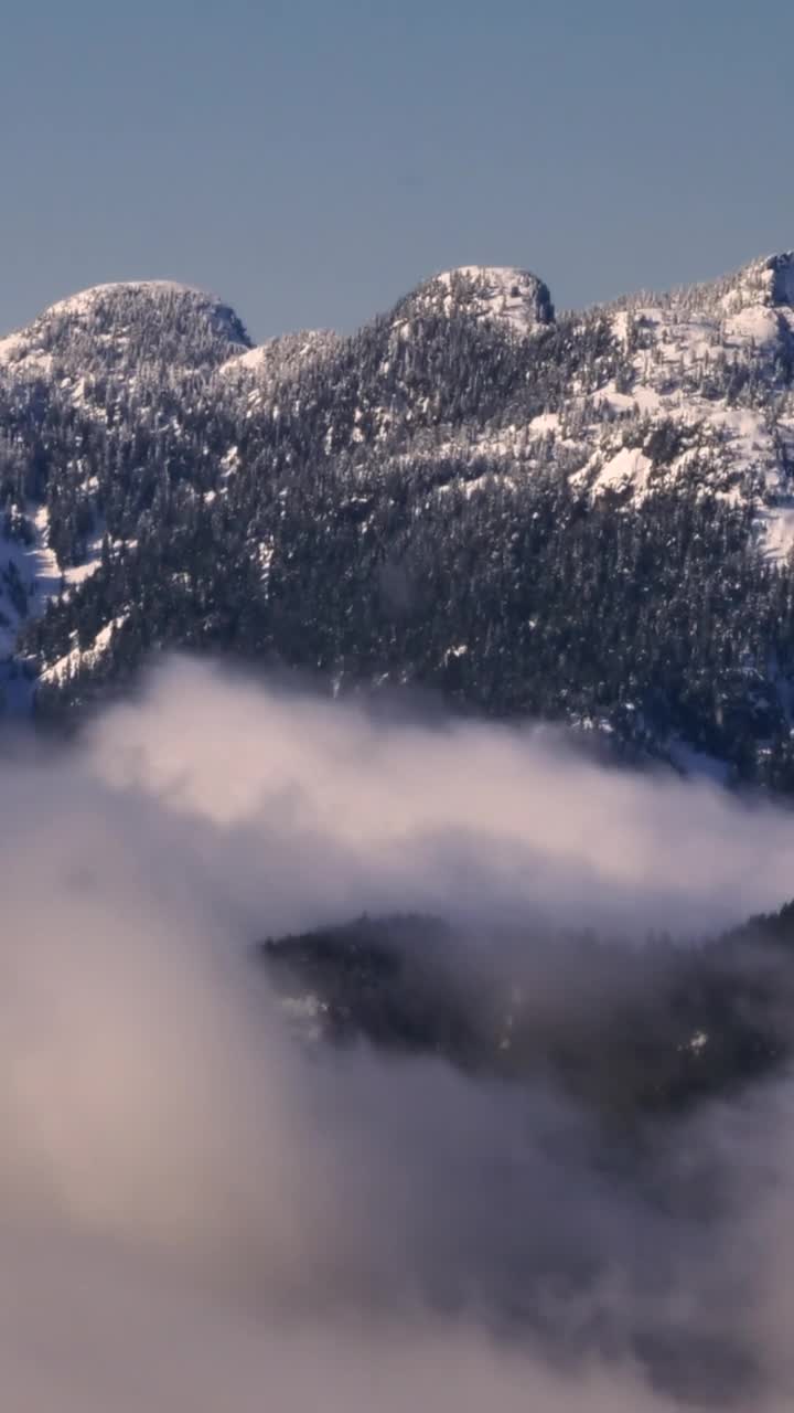 Stock Video Mist At The Base Of A Snowy Mountai Animated Wallpaper